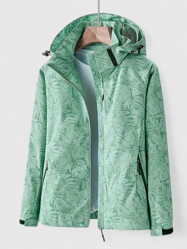 Green hooded jacket with front zipper and stand collar, leaf-patterned design