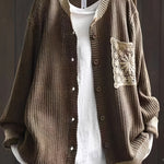 Dark brown knit cardigan, button front, ribbed trim, long sleeves, crocheted chest patch