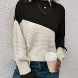 Black and white color-block pullover sweater with long sleeves and crew neck
