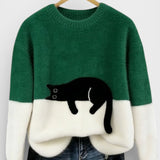 Green and white two-tone sweatshirt with black cat graphic on the front