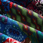 Remi™ patchwork jacket fabric close-up with colorful geometric tiles and stitching