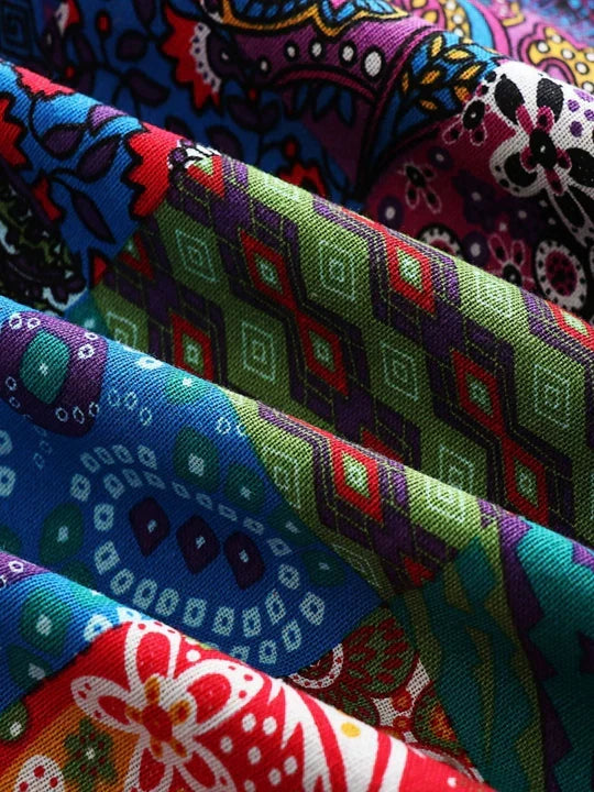 Remi™ patchwork jacket fabric close-up with colorful geometric tiles and stitching