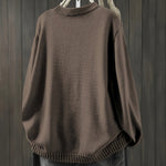 Brown cardigan sweater with ribbed collar, cuffs, and hem