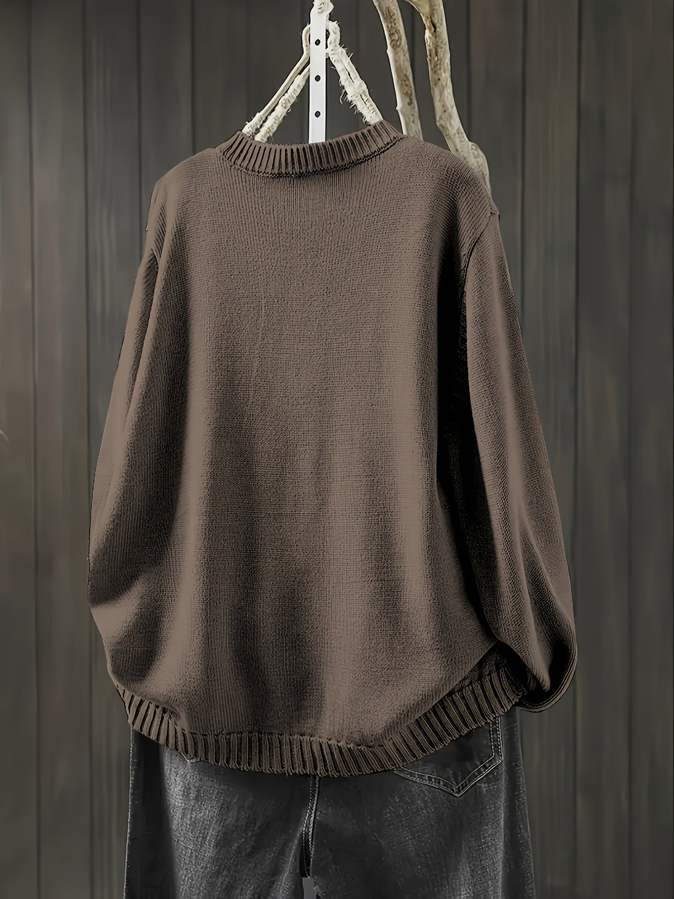 Brown cardigan sweater with ribbed collar, cuffs, and hem