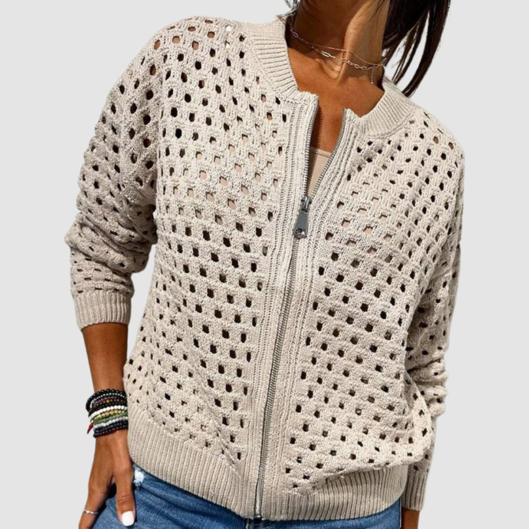 Light beige knit cardigan with full-zip front and textured dotted pattern.
