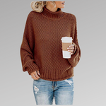 Rust brown chunky knit sweater with ribbed turtleneck, long sleeves, and straight hem