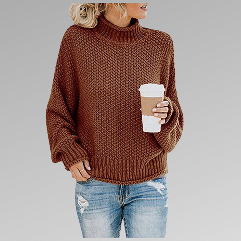 Rust brown chunky knit sweater with ribbed turtleneck, long sleeves, and straight hem