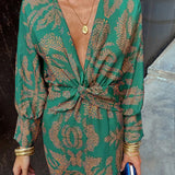 Green patterned V-neck midi dress with knotted front and long sleeves