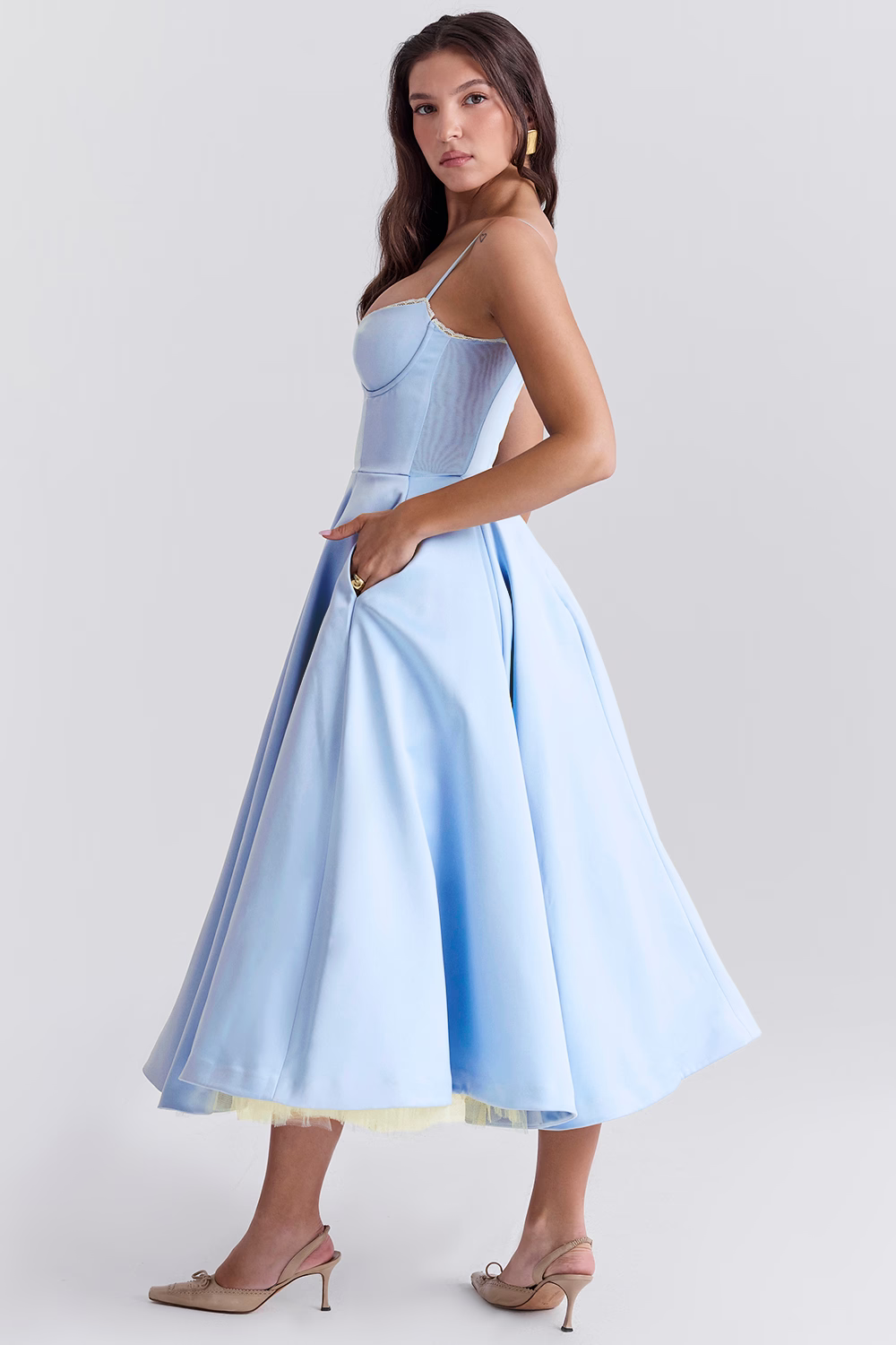 Light blue fitted corset dress with spaghetti straps and gathered flared midi skirt