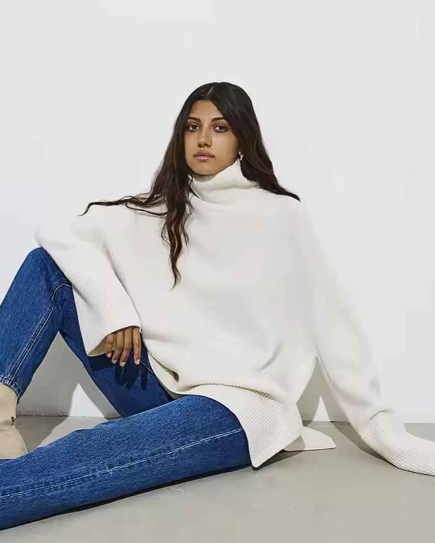 White oversized turtleneck sweater with long sleeves and ribbed hem