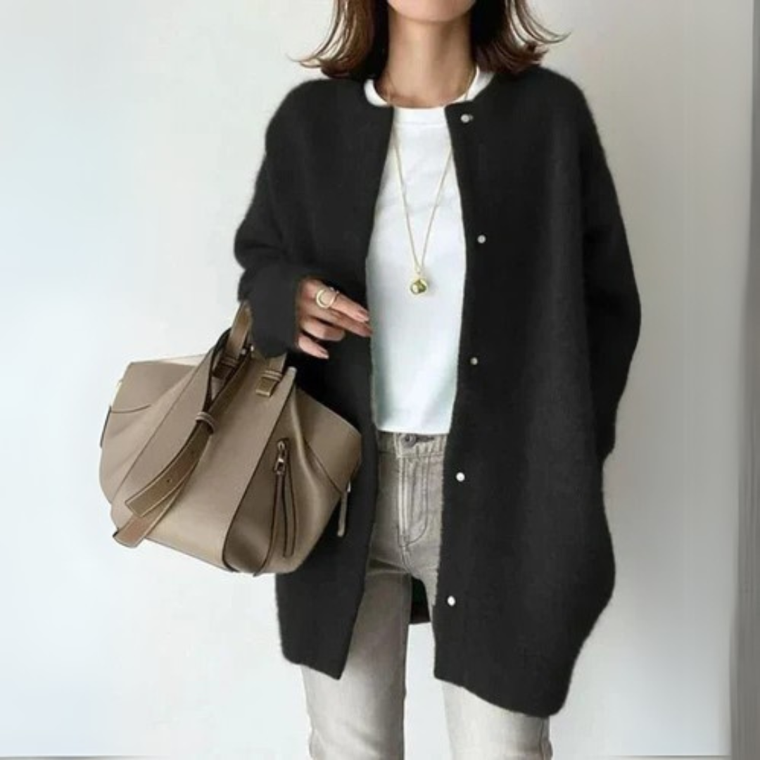 Black open-front cardigan with long sleeves and snap-button placket