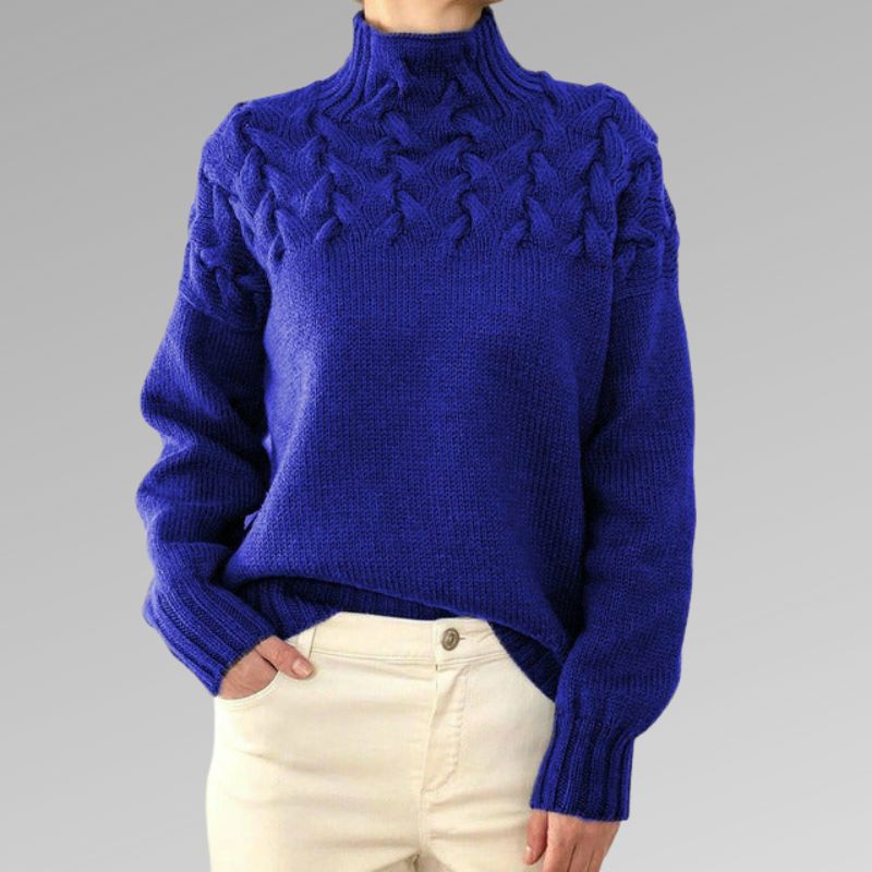 Women's cable-knit turtleneck sweater, royal blue with raised cable pattern.