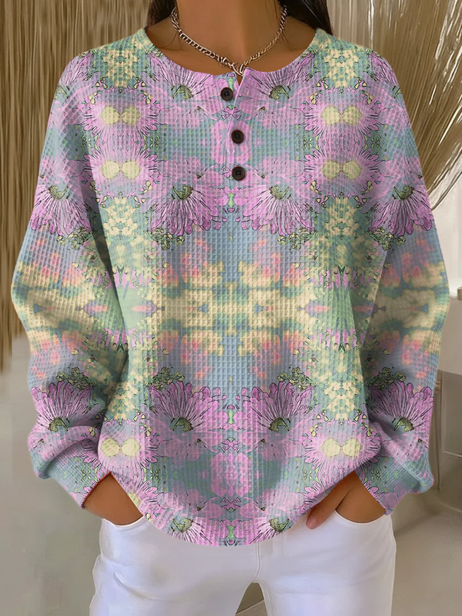 Ethnic floral pullover with long sleeves, light pink, and button placket