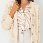 Cream knit cardigan with button front, textured knit, and ribbed cuffs, front view