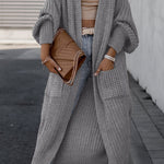 Light gray long knit cardigan with open front, long sleeves, and side pockets