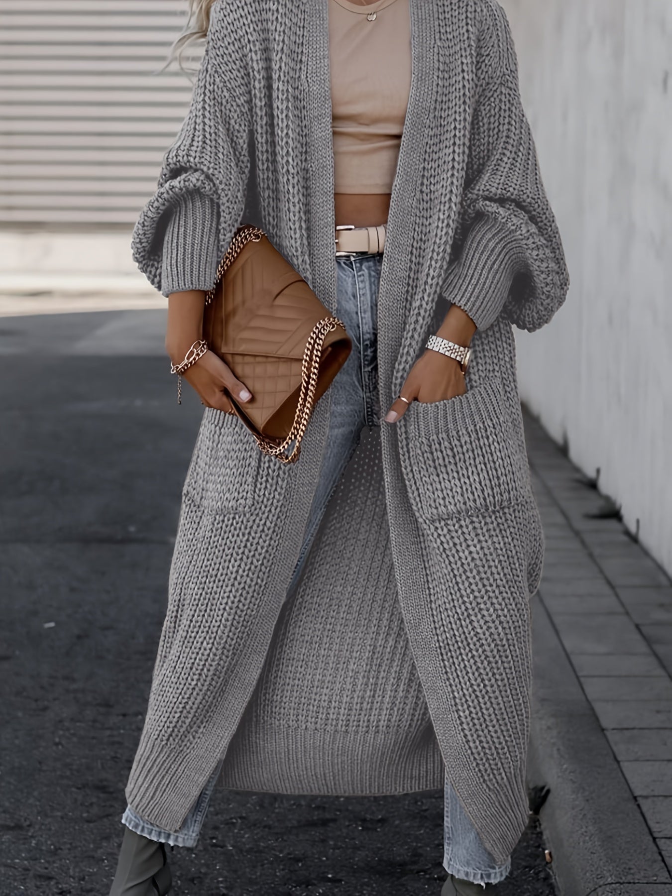 Light gray long knit cardigan with open front, long sleeves, and side pockets