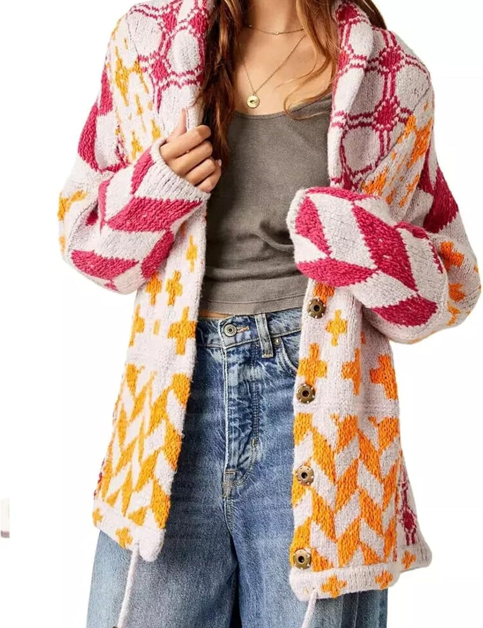 Oversized vintage cardigan in off-white with red and orange geometric knit, button front.