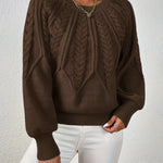 Dark brown cable-knit long-sleeve pullover with half-zip neckline and ribbed cuffs