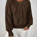 Dark brown cable-knit long-sleeve pullover with half-zip neckline and ribbed cuffs