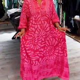 Pink printed V-neck midi dress, front view, 3/4 sleeves and button front