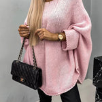 Pink knit pullover with textured stitch, relaxed batwing sleeves and crew neckline