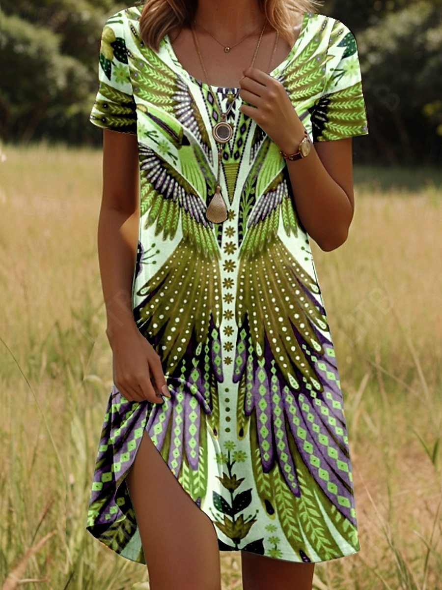 Bohemian print dress with short sleeves, bright green/yellow base and detailed feather motifs