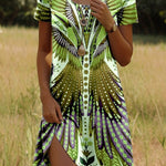 Bohemian print dress with short sleeves, bright green/yellow base and detailed feather motifs