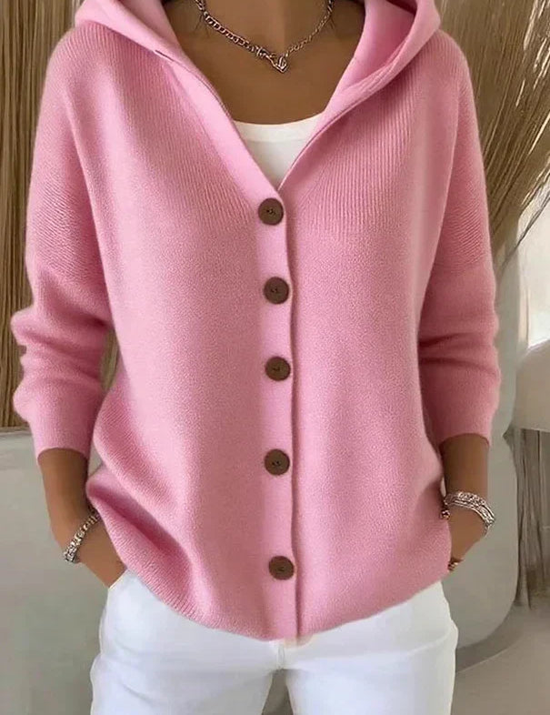 Pink hooded cardigan sweater with dark buttons and long sleeves