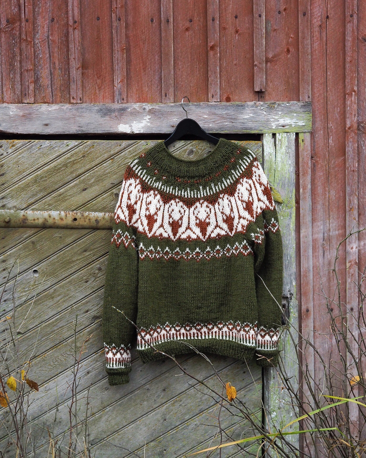 Olive knit pullover sweater with Fair Isle yoke and patterned hem, crew neckline