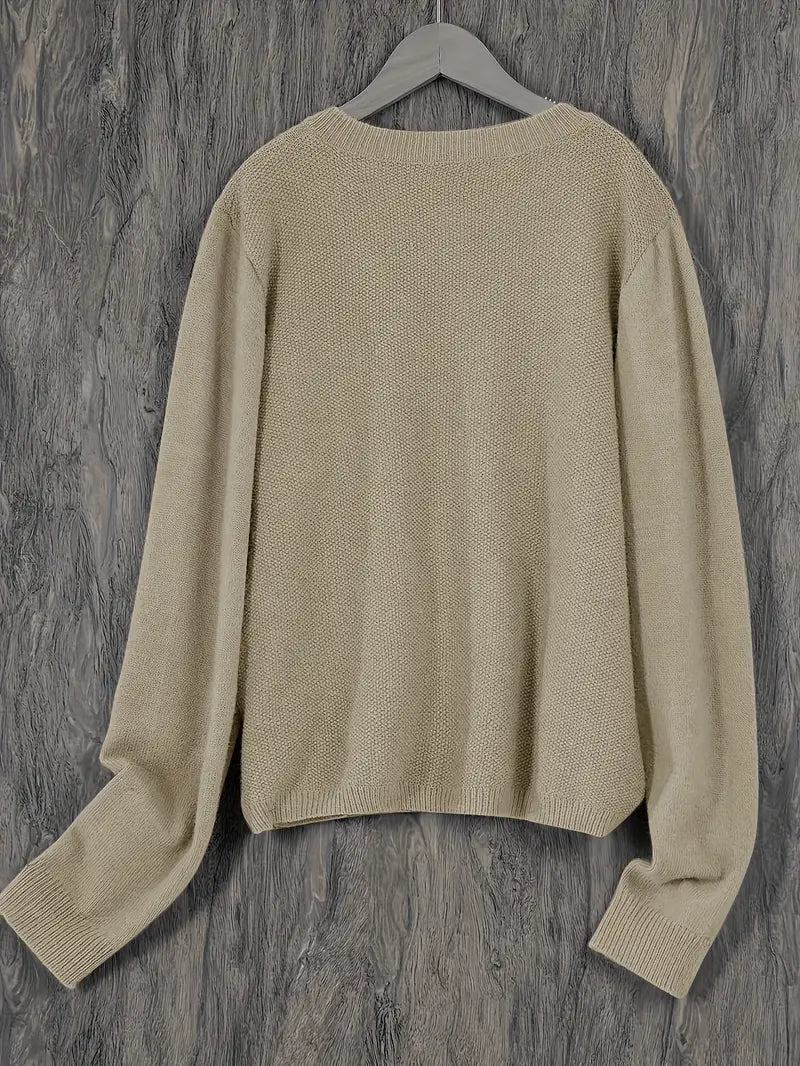 Women’s round-neck cardigan with long sleeves, light beige knit texture, cropped back view