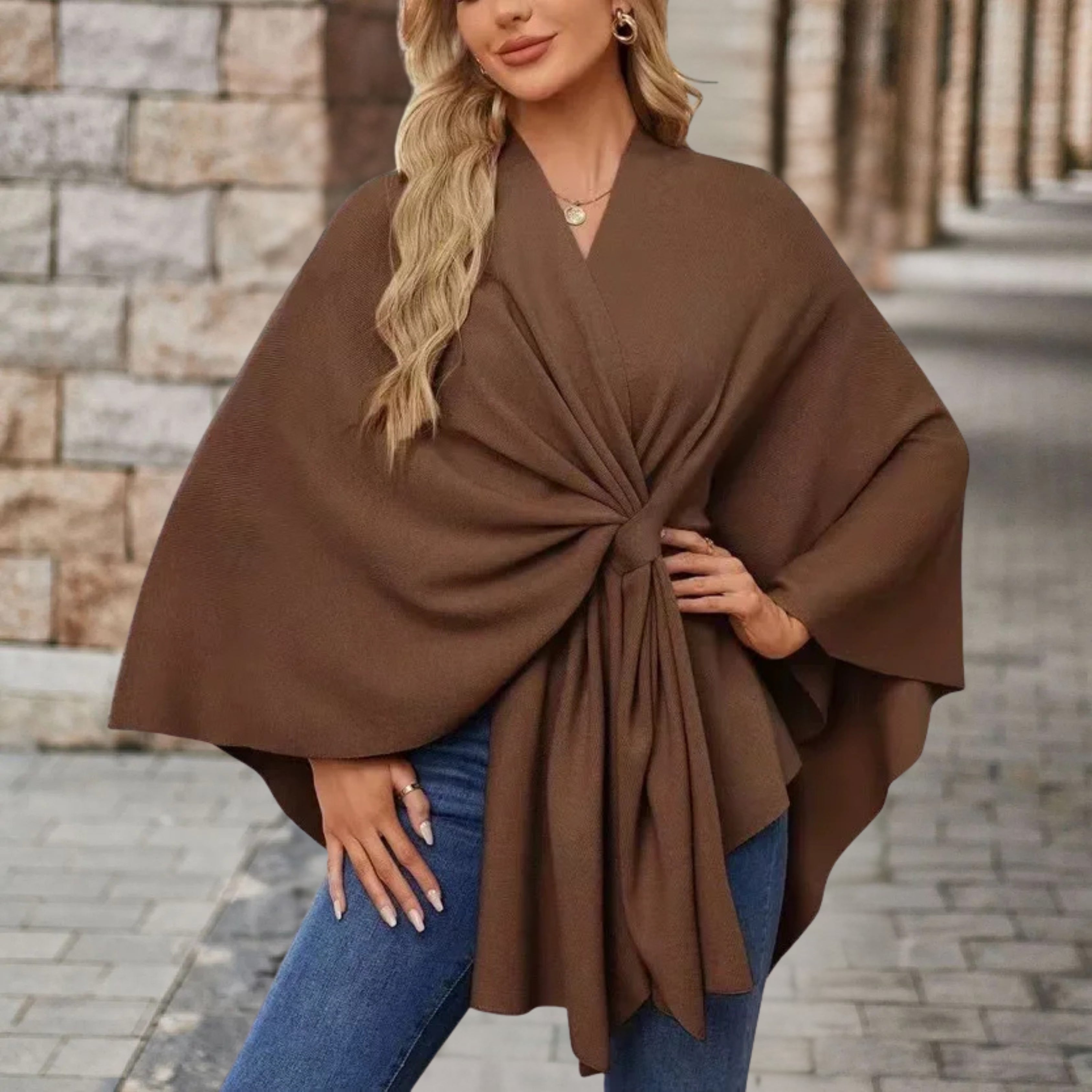 Brown draped poncho with V-neck and gathered front knot, wide cape sleeves