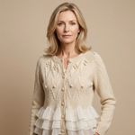 Cream ruffle-front cardigan with button placket, textured bobble knit, and tiered hem