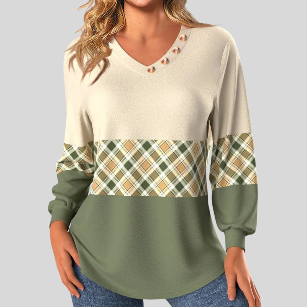 Women's pullover, cream knit with green plaid band and V-neck metal snap placket