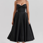 Black fitted corset bodice dress with thin straps and full flared midi skirt