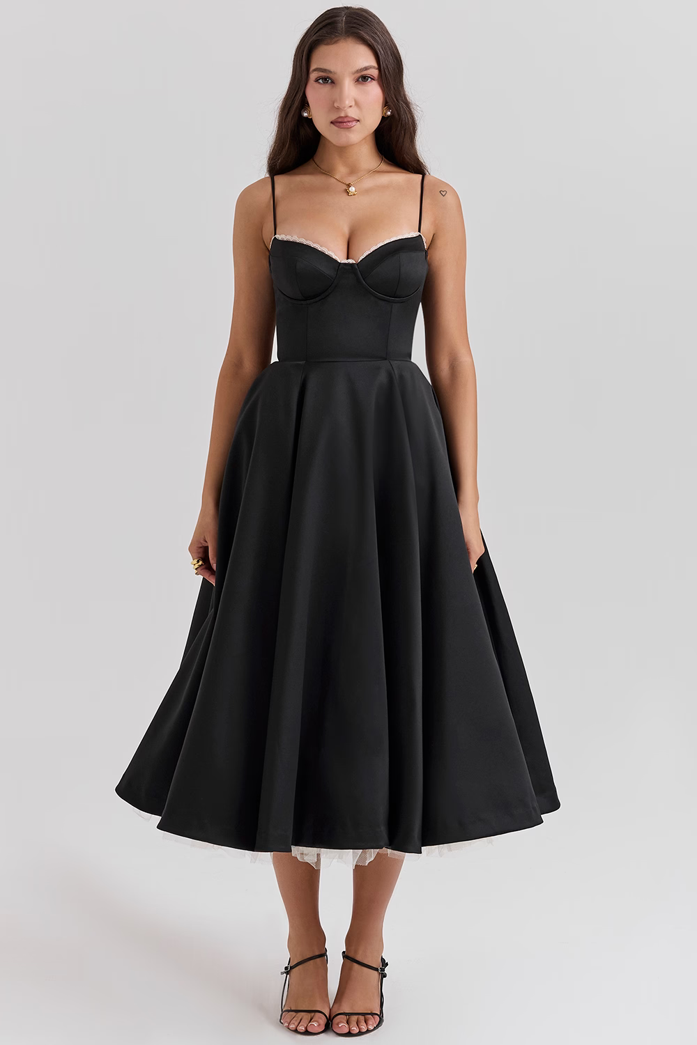 Black fitted corset bodice dress with thin straps and full flared midi skirt