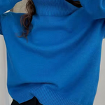 Oversized bright blue turtleneck knit sweater with ribbed collar and cuffs