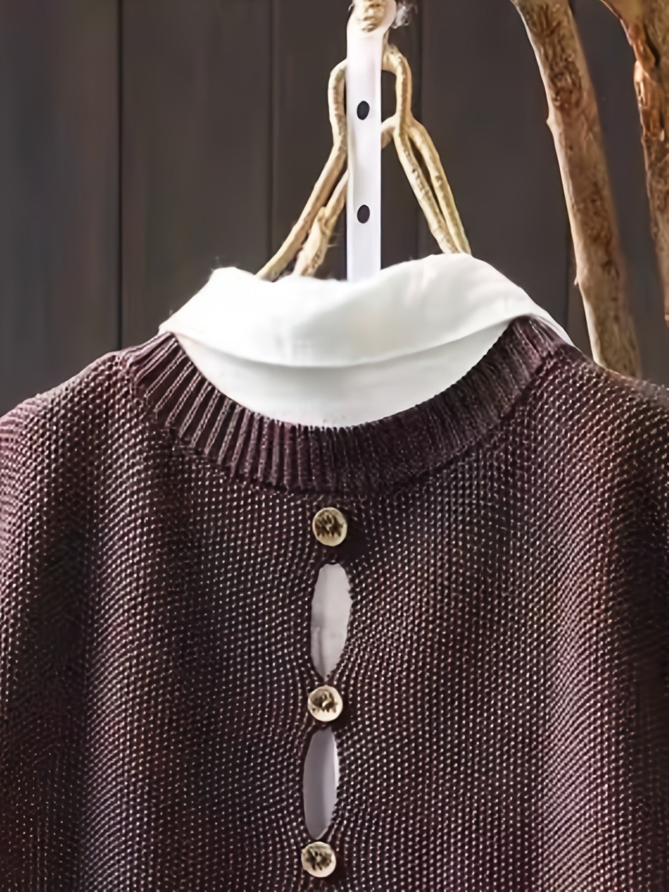 Brown knit sleeveless cardigan with cowl neck and row of round gold-tone buttons