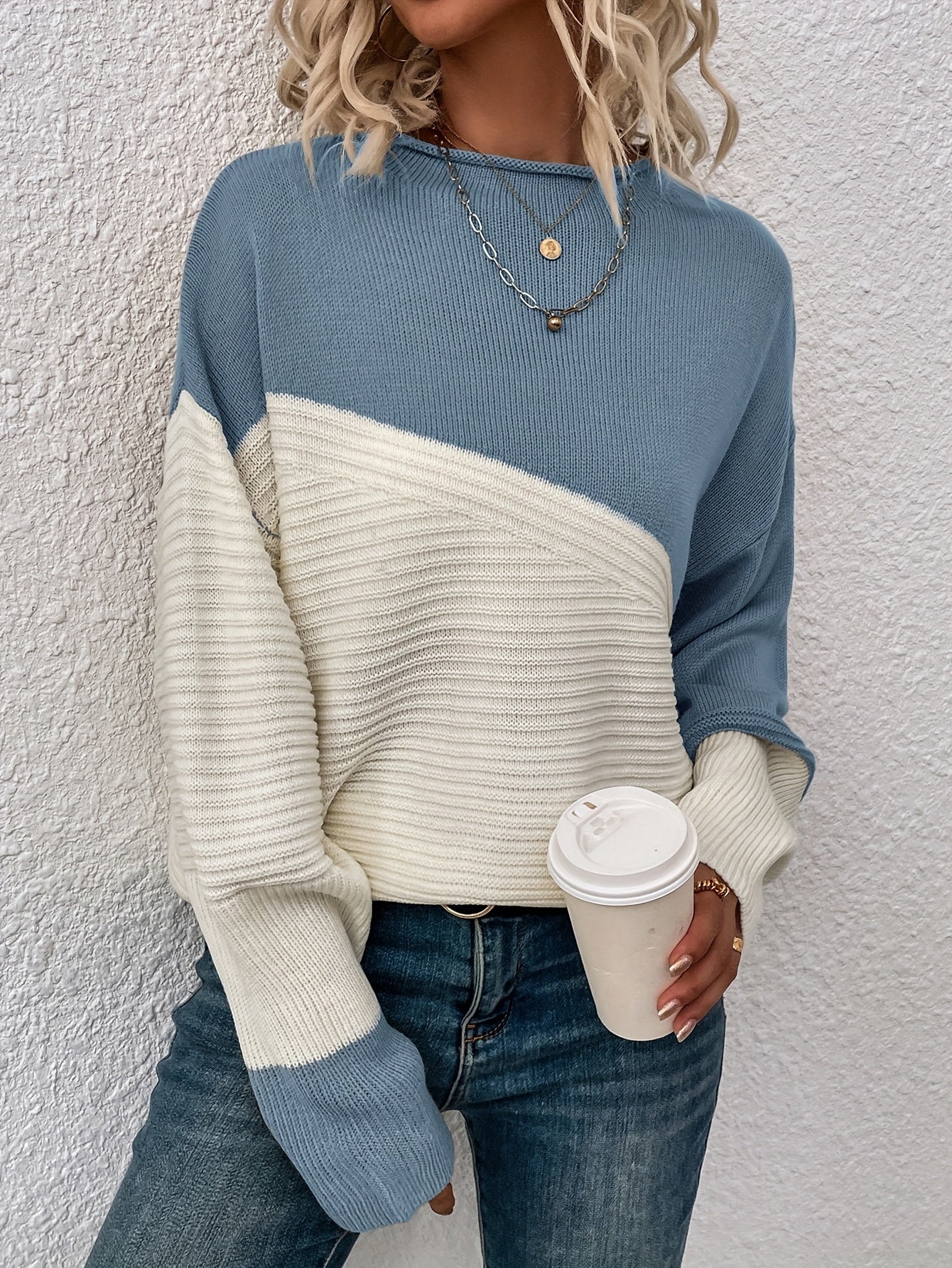 Blue and white color-block pullover sweater with long sleeves and crew neck