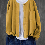 Mustard yellow round-neck cardigan with button front and side pocket