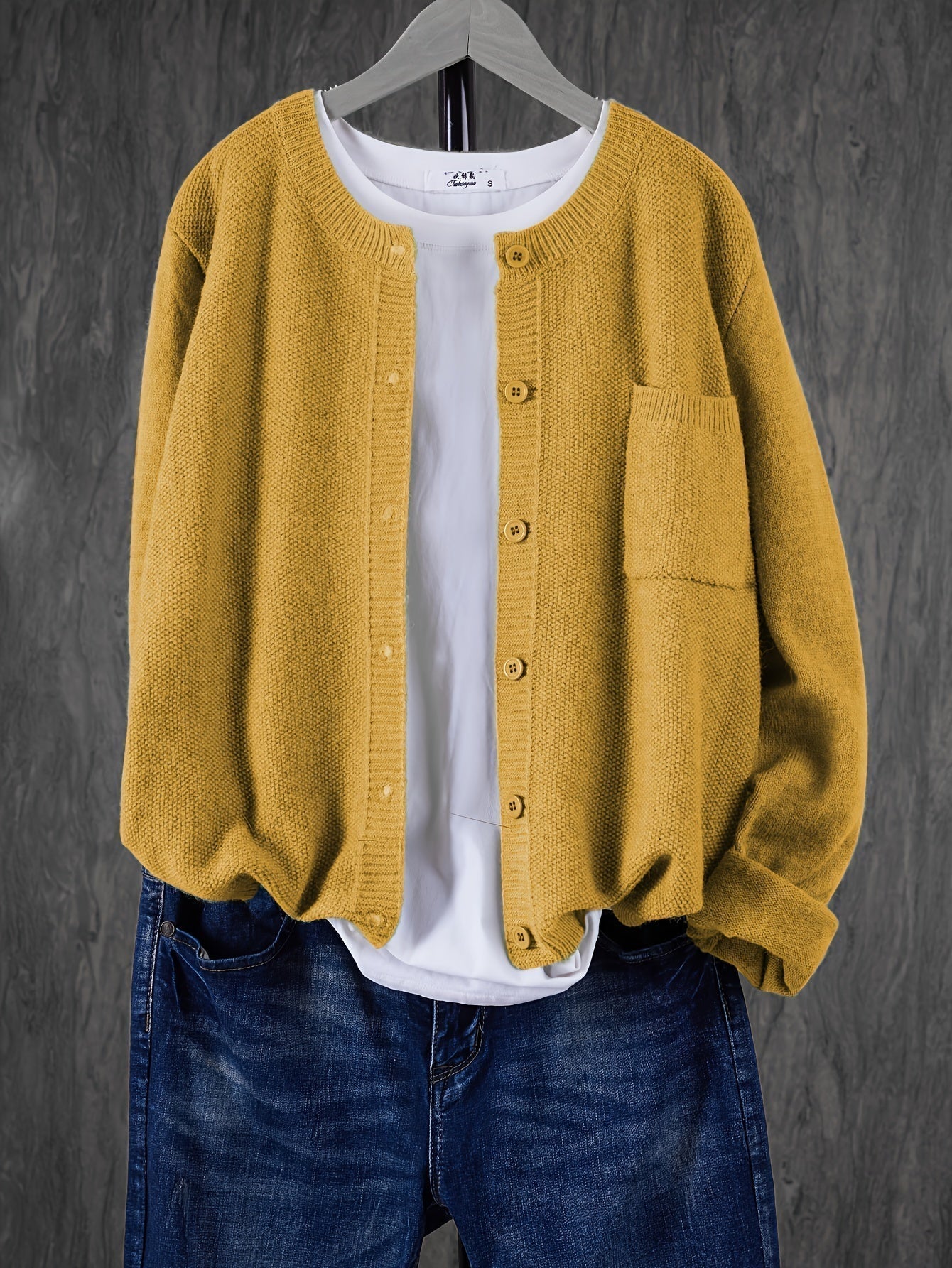 Mustard yellow round-neck cardigan with button front and side pocket
