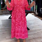 Pink printed V-neck midi dress with 3/4 sleeves and button front