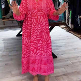 Pink printed V-neck midi dress with 3/4 sleeves and button front