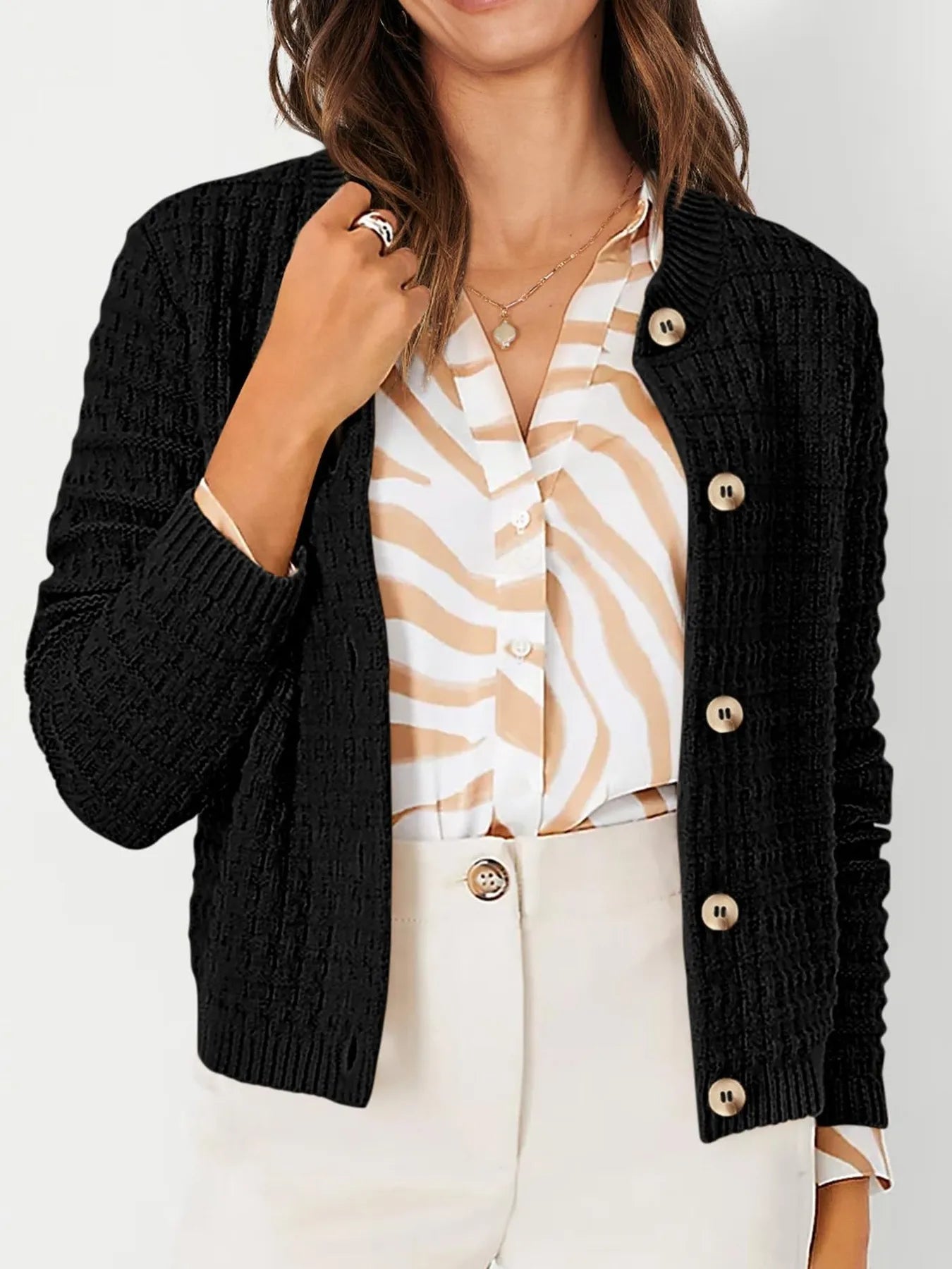 Womens knit cardigan with button front, black textured knit and long sleeves