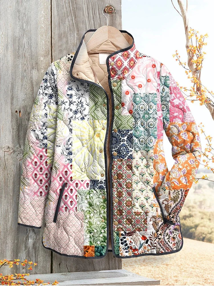 Women's quilted zip-up jacket with multicolor floral patchwork and dark trim