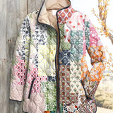 Women's quilted zip-up jacket with multicolor floral patchwork and dark trim