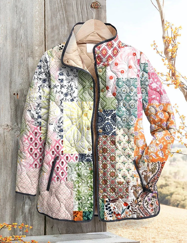 Women's quilted zip-up jacket with multicolor floral patchwork and dark trim