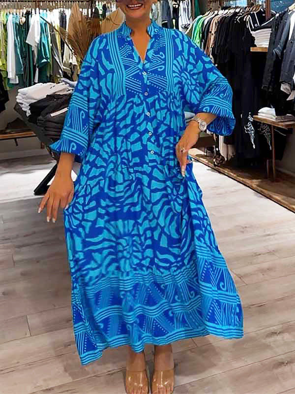 Blue printed V-neck midi dress, side view, 3/4 sleeves and button front