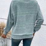 Light green striped knit pullover with batwing sleeves, ribbed cuffs and hem