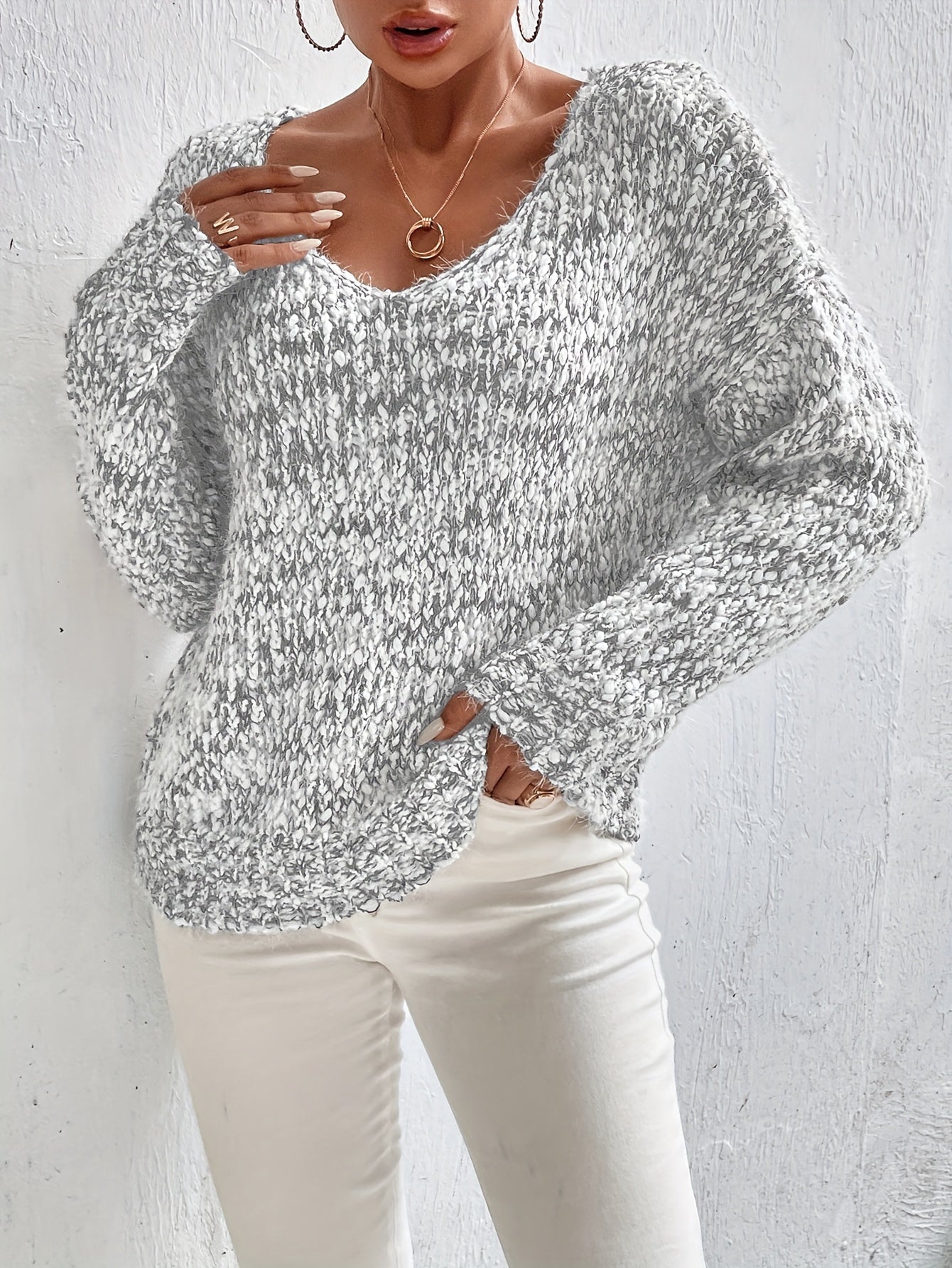 Loose knit pullover sweater with long sleeves, heather gray speckled texture