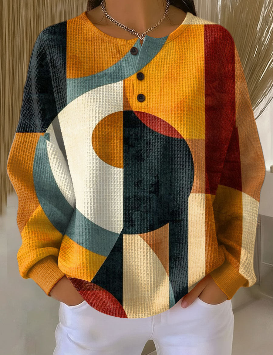 Orange geometric-pattern waffle-knit pullover sweater with button placket and long sleeves
